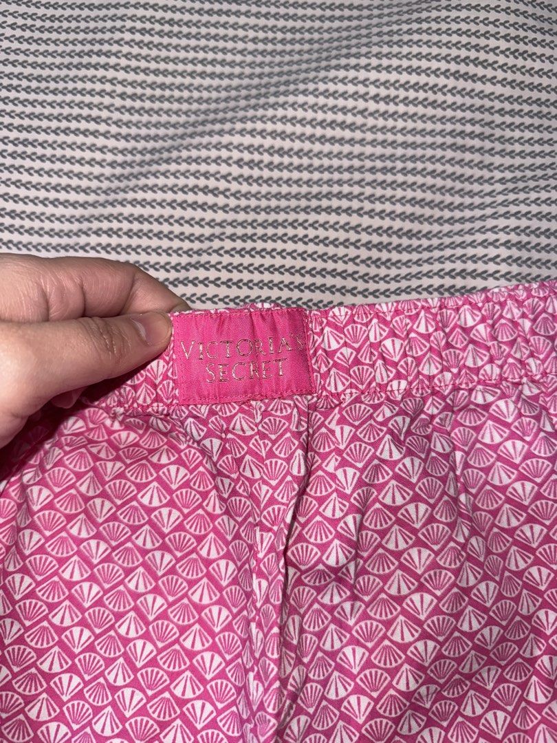 Victoria's Secret Pink Shell Pattern Sleep Shorts (Category: Undergarments & Loungewear) located in Santa Ana. Submitted by fatikilla (Listing ID 1470360292, Image 2). Description: - Brand: Victoria's Secret - Design: Bright pink and white shell print with front woven brand patch - Fit: Relaxed fit with a comfortable elastic waistband - Size: Medium (170/72A) - Origin: Made in Sri Lanka - Condition: Clean, fresh, and ready to wear - Ideal for: Sl