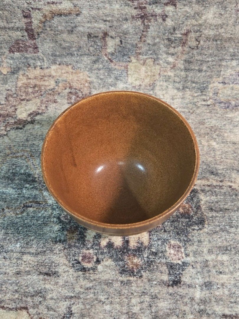 Vintage studio hakeme tea bowl (Category: Coffee & Tea Tableware) located in Manila. Submitted by cwknds (Listing ID 1470516124, Image 2). Description: ​an authentic japanese studio stoneware tea bowl (yunomi). finished in a warm cinnamon ash glaze and accented by a gestural cream hakame slip brushstroke across the front. the base features an impressed artisan studio seal (kamajirushi) on the raw terracotta foot ring. (chasen shown for scale comp