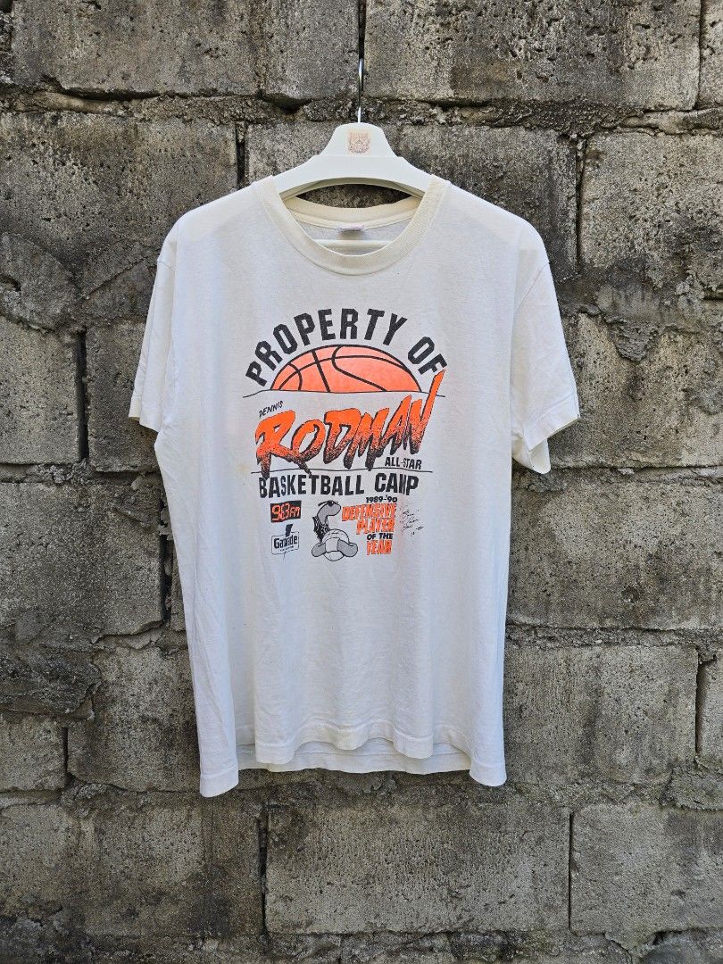 Vintage 90s Dennis Rodman (Category: Tshirts & Polo Shirts ) located in Mabalacat. Submitted by chowdervtg (Listing ID 1470495004, Image 1). Description: 🏀 VINTAGE DENNIS RODMAN — THE WORM A tribute to one of the most iconic defenders in NBA history. Property of Dennis Rodman 1989–90 All-Star Basketball Camp Detroit Pistons #10 Featuring the legendary Worm in his prime-era Pistons days, with bold orange graphics, basketball camp details, and the
