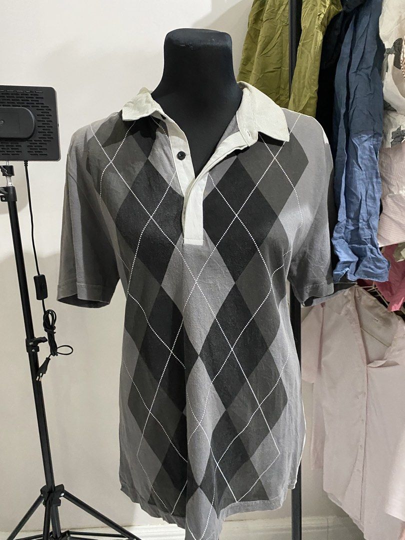 Vintage Argyle Pattern Short Sleeve Polo Shirt Grey (Category: Tshirts & Polo Shirts ) located in Manila. Submitted by mpt99876 (Listing ID 1470497189, Image 1). Description: - Style: Casual retro short-sleeve polo shirt - Design: Classic argyle diamond pattern front with solid light grey corduroy-style back panel - Colorway: Grey, black, and light grey - Details: Light grey ribbed collar and placket, single-button neck closure - Versatility: Eas