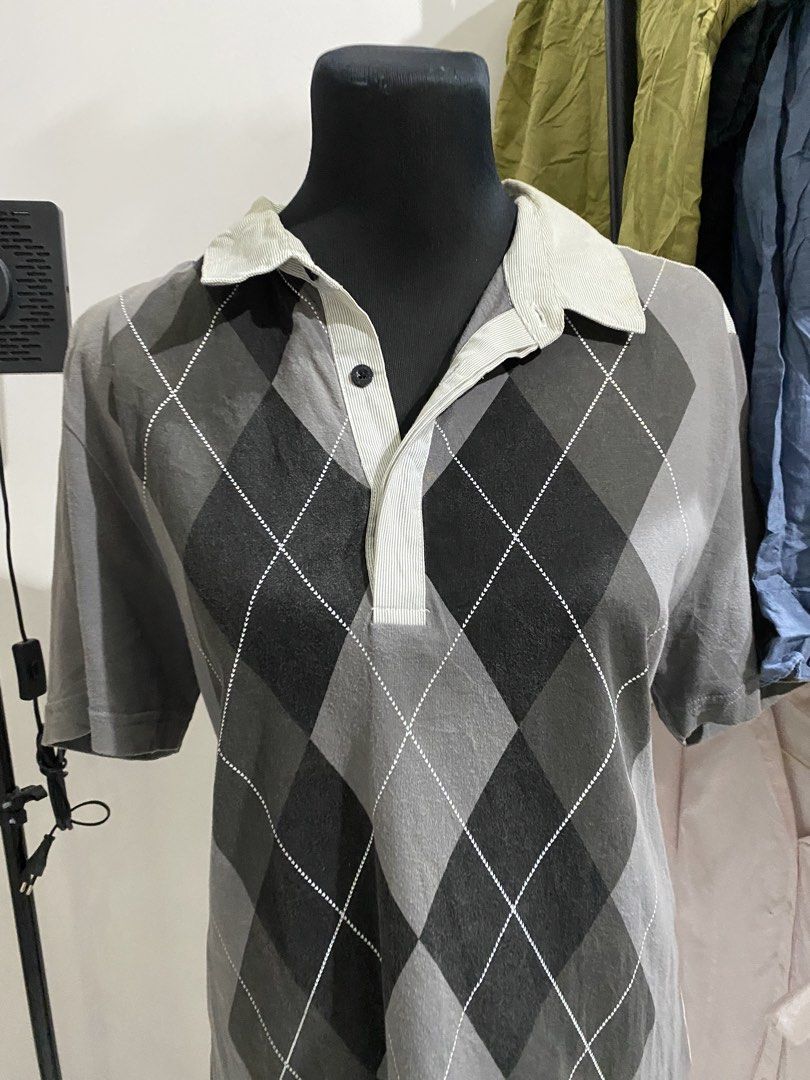 Vintage Argyle Pattern Short Sleeve Polo Shirt Grey (Category: Tshirts & Polo Shirts ) located in Manila. Submitted by mpt99876 (Listing ID 1470497189, Image 2). Description: - Style: Casual retro short-sleeve polo shirt - Design: Classic argyle diamond pattern front with solid light grey corduroy-style back panel - Colorway: Grey, black, and light grey - Details: Light grey ribbed collar and placket, single-button neck closure - Versatility: Eas