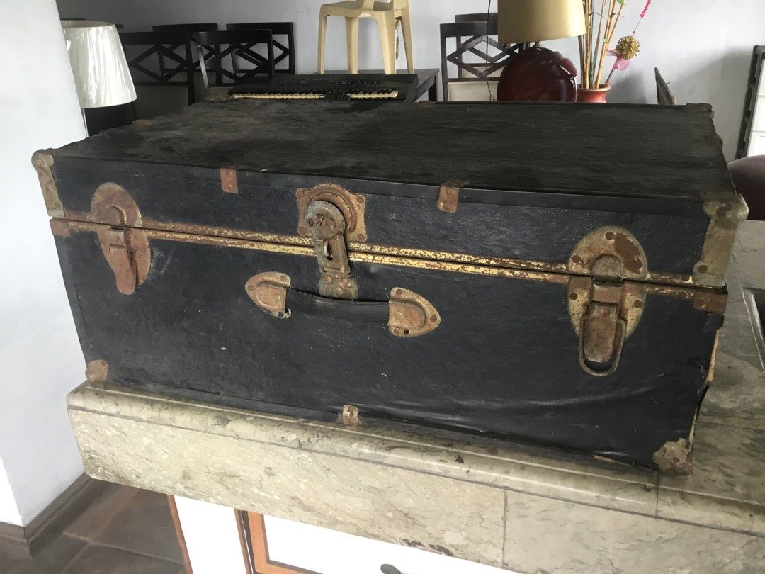 Vintage Black Storage Trunk with Metal Hardware (Category: Shelves, Cabinets & Racks) located in Manila. Submitted by roberto.enriquez (Listing ID 1470556793, Image 3). Description: - Color: Black exterior with metal hardware - Features: Metal latches, corner brackets, and sturdy carrying handle - Interior: Lined with particle board and plywood panels with a vintage address label inside the lid - Condition: Solid and functional structure, with vi