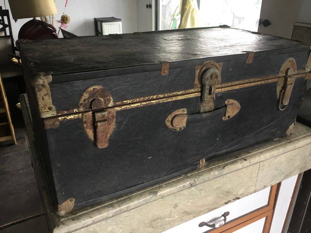 Vintage Black Storage Trunk with Metal Hardware (Category: Shelves, Cabinets & Racks) located in Manila. Submitted by roberto.enriquez (Listing ID 1470556793, Image 2). Description: - Color: Black exterior with metal hardware - Features: Metal latches, corner brackets, and sturdy carrying handle - Interior: Lined with particle board and plywood panels with a vintage address label inside the lid - Condition: Solid and functional structure, with vi