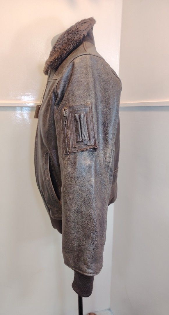 Vintage Brown Leather Bomber Jacket with Fur Collar (Category: Coats, Jackets and Outerwear) located in La Trinidad. Submitted by padasem_kadi (Listing ID 1470367521, Image 3). Description: - Style: Distressed brown leather jacket with cozy sherpa collar - Closure: Durable YKK metal zipper - Features: Ribbed cuffs and hem to block the wind, left sleeve utility pocket with pen slots, and two deep side pockets - Measurements (laid flat): 24 inch sl