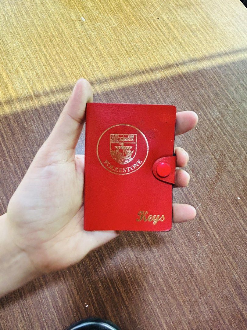Vintage Folkestone Red Leather 6-Hook Key Case Holder (Category: Wallets & Card holders) located in Manila. Submitted by starbalesukandjapansurplus (Listing ID 1470555283, Image 1). Description: Red leather key case with gold foil Folkestone crest stamp and "Keys" lettering. Secure snap button closure. Inside has a gold-tone 6-hook hardware strip for organizing keys. Compact size fits easily in pockets or bags..