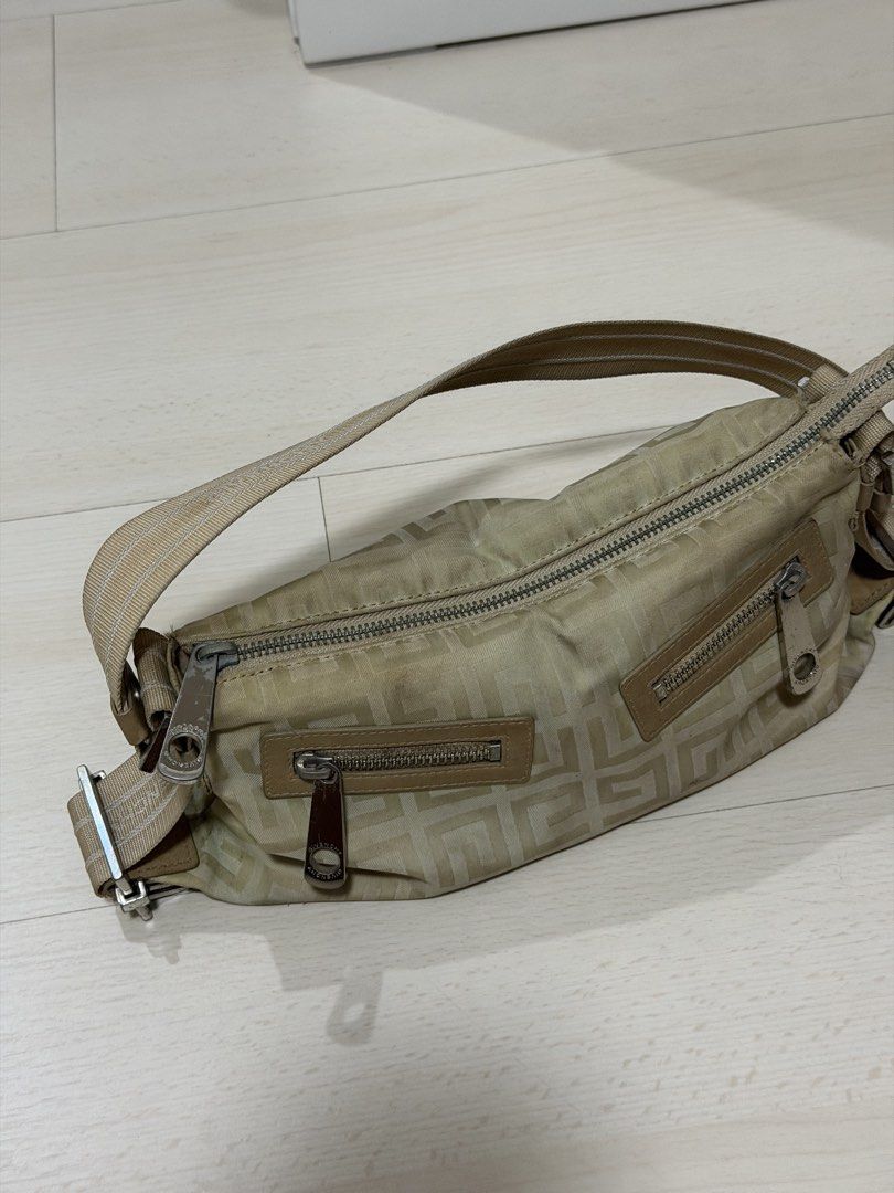 Vintage Givenchy 4G Monogram Nylon Shoulder Bag Beige (Category: Luxury Bags & Wallets) located in Las Pinas. Submitted by reijeancaraig (Listing ID 1470469341, Image 3). Description: - Authentic Givenchy shoulder bag in classic beige 4G monogram nylon - Adjustable webbed strap for comfortable wear - Secure main zip closure with two handy front zip pockets - Premium silver-tone hardware and chic leather trim details - Trendy Y2K vintage aesthetic