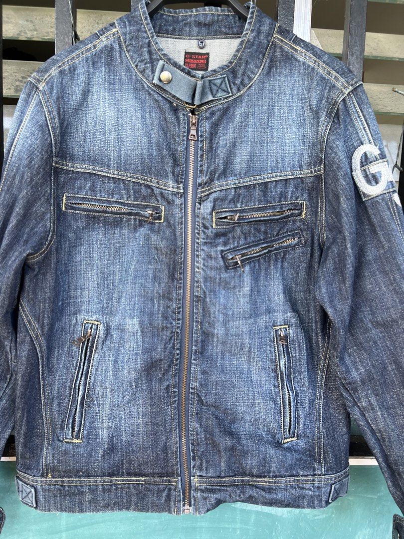 Vintage G-Star Motorcycle Biker Denim Jacket (Category: Coats, Jackets and Outerwear) located in Cavite. Submitted by slumbermanila (Listing ID 1470398323, Image 3). Description: Vintage G-Star RAW dark-wash denim motorcycle/rider jacket featuring a snap-button stand collar, asymmetrical front zipper pockets, and a G-Star logo patch on the left sleeve..
