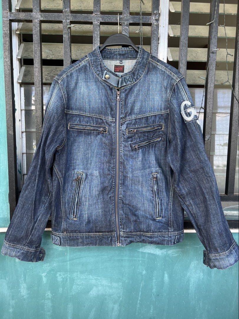 Vintage G-Star Motorcycle Biker Denim Jacket (Category: Coats, Jackets and Outerwear) located in Cavite. Submitted by slumbermanila (Listing ID 1470398323, Image 1). Description: Vintage G-Star RAW dark-wash denim motorcycle/rider jacket featuring a snap-button stand collar, asymmetrical front zipper pockets, and a G-Star logo patch on the left sleeve..
