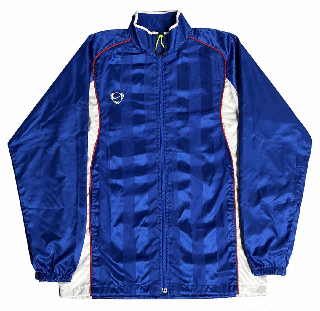 Vintage Nike Blue Track Jacket Windbreaker (Category: Coats, Jackets and Outerwear) located in Cavite. Submitted by alchaxx11 (Listing ID 1470479622, Image 1). Description: NIKE VINTAGE TRACK JACKET 26 x 21 ISSUE: MINIMAL FLAWS SA PRINT NEGO.