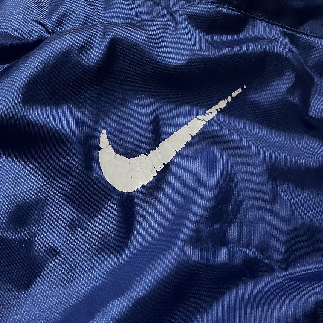 Vintage Nike Blue Track Jacket Windbreaker (Category: Coats, Jackets and Outerwear) located in Cavite. Submitted by alchaxx11 (Listing ID 1470479622, Image 3). Description: NIKE VINTAGE TRACK JACKET 26 x 21 ISSUE: MINIMAL FLAWS SA PRINT NEGO.