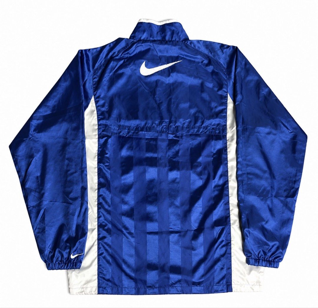 Vintage Nike Blue Track Jacket Windbreaker (Category: Coats, Jackets and Outerwear) located in Cavite. Submitted by alchaxx11 (Listing ID 1470479622, Image 2). Description: NIKE VINTAGE TRACK JACKET 26 x 21 ISSUE: MINIMAL FLAWS SA PRINT NEGO.