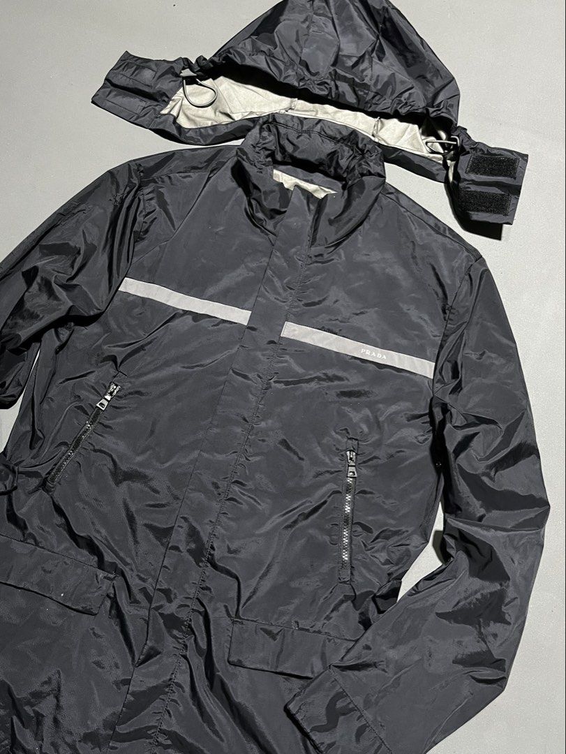 Vintage Prada Sport - Parka Windbreaker Jacket (Category: Luxury Apparel) located in Bacolod City. Submitted by rndm.wears (Listing ID 1470529192, Image 2). Description: Vintage Prada Windbreaker Jacket Packable Hood Adjustable sides with snap buttons Length: 32 Width: 23.