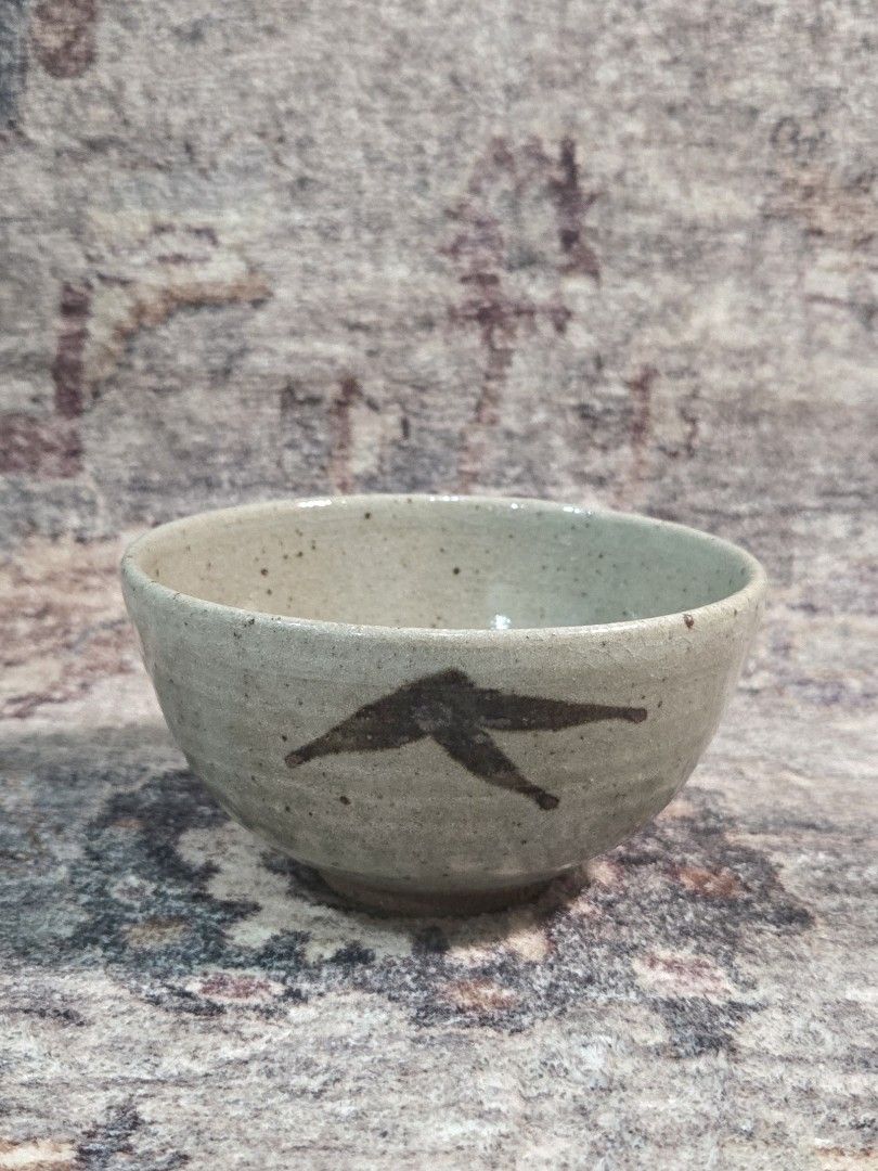 Vintage rustic studio chawan matcha bowl (Category: Coffee & Tea Tableware) located in Manila. Submitted by cwknds (Listing ID 1470514985, Image 1). Description: an authentic japanese studio tea bowl (chawan) handthrown in coarse iron clay. covered in a pale celadon-ash glaze with natural iron speckling and fine craze lines (kannyū). the base displays an undipped raw clay foot, highlighting the wabisabi contrast between glazed and unglazed textur