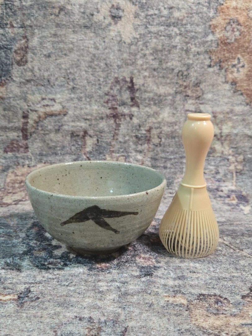 Vintage rustic studio chawan matcha bowl (Category: Coffee & Tea Tableware) located in Manila. Submitted by cwknds (Listing ID 1470514985, Image 3). Description: an authentic japanese studio tea bowl (chawan) handthrown in coarse iron clay. covered in a pale celadon-ash glaze with natural iron speckling and fine craze lines (kannyū). the base displays an undipped raw clay foot, highlighting the wabisabi contrast between glazed and unglazed textur