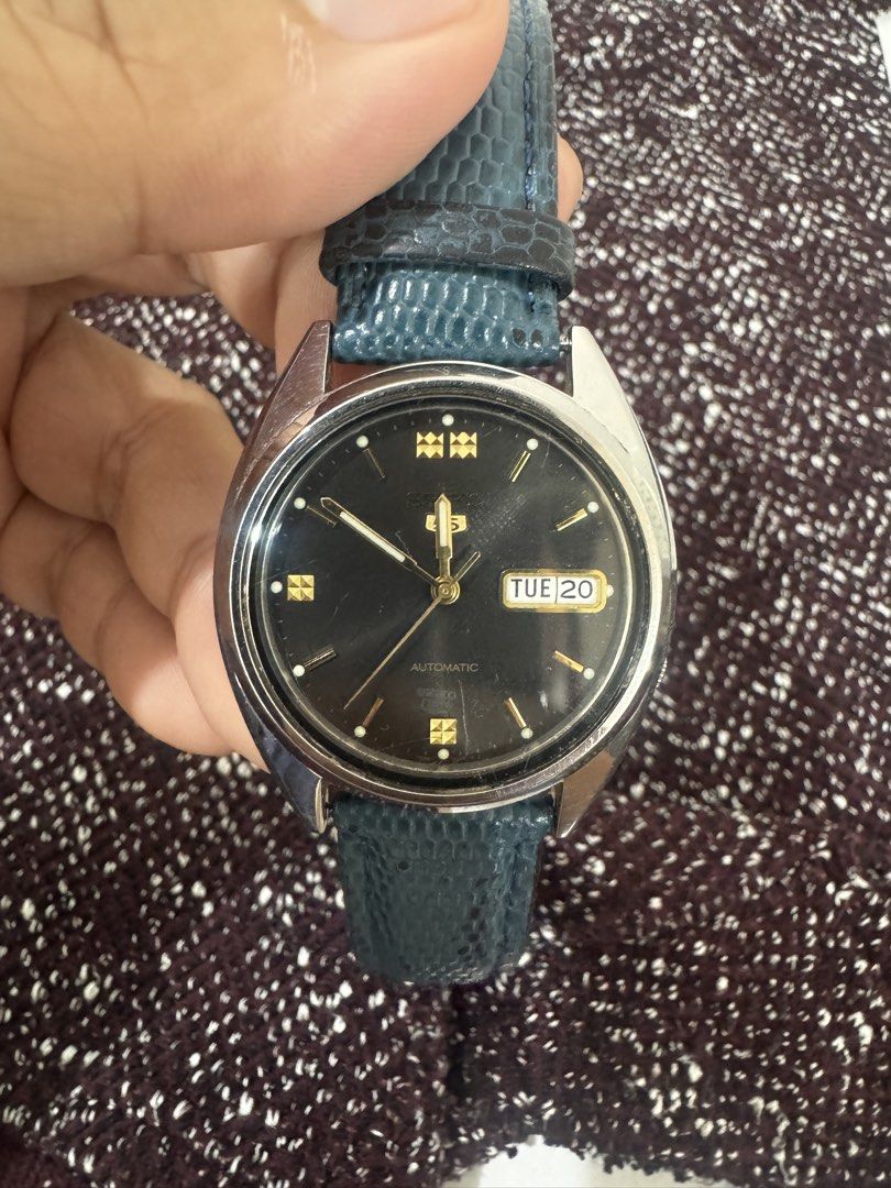 Vintage Seiko 5 Automatic Watch Black Dial Blue Strap (Category: Men's Watches) located in Makati City. Submitted by yungkatabiko (Listing ID 1470359466, Image 2). Description: Vintage Seiko 5 Automatic (7S26-3040) – Black Dial with Gold Accents – Rare Find 🔥🔥🔥 Selling my vintage Seiko 5, a classic piece from the early 2000s. This is the Seiko 5 ref. 7S26-3040 with a stunning black dial and distinct gold markers. The watch is in good working c