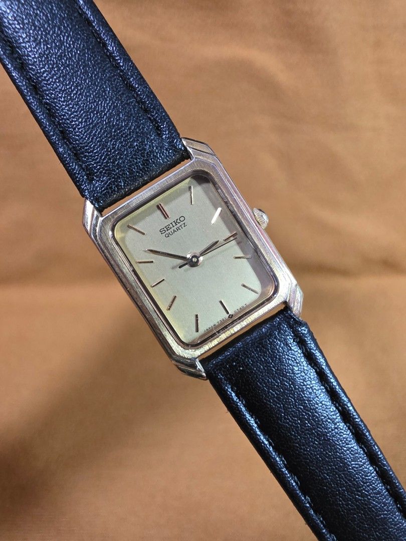 Vintage Seiko Quartz Rectangular Watch with Black Leather Strap (Category: Women's Watches) located in Rosales. Submitted by akumie30 (Listing ID 1470532275, Image 1). Description: - Authentic vintage rectangular Seiko watch imported from Japan - Elegant gold-tone case paired with a textured black leather strap - Minimalist champagne dial with clean stick markers and simple hands - Reliable quartz movement for accurate timekeeping - Versatile des