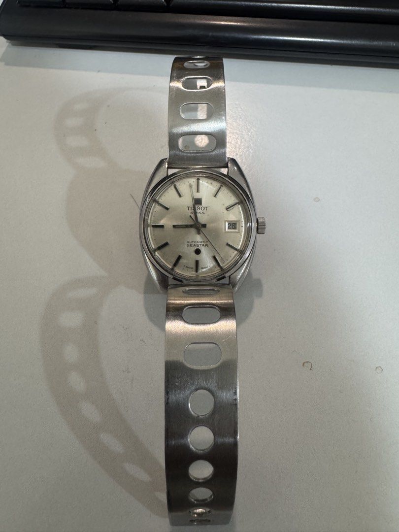Vintage Tissot Seastar Automatic Watch (Category: Men's Watches) located in Laguindingan. Submitted by kixseven (Listing ID 1470353527, Image 2). Description: - Brand: Tissot Seastar - Movement: Swiss-made automatic - Dial: Silver with 3 o'clock date window - Crown: Textured with Tissot logo - Strap: Stainless steel racing-style perforated bracelet - Condition: Keeps good time, normal signs of wear on case and bracelet from regular use - NO COD ❌
