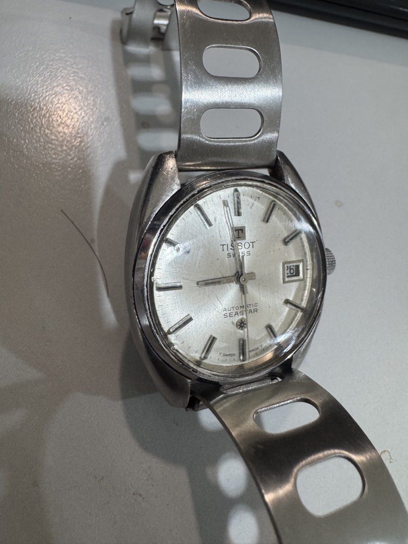 Vintage Tissot Seastar Automatic Watch (Category: Men's Watches) located in Laguindingan. Submitted by kixseven (Listing ID 1470353527, Image 3). Description: - Brand: Tissot Seastar - Movement: Swiss-made automatic - Dial: Silver with 3 o'clock date window - Crown: Textured with Tissot logo - Strap: Stainless steel racing-style perforated bracelet - Condition: Keeps good time, normal signs of wear on case and bracelet from regular use - NO COD ❌