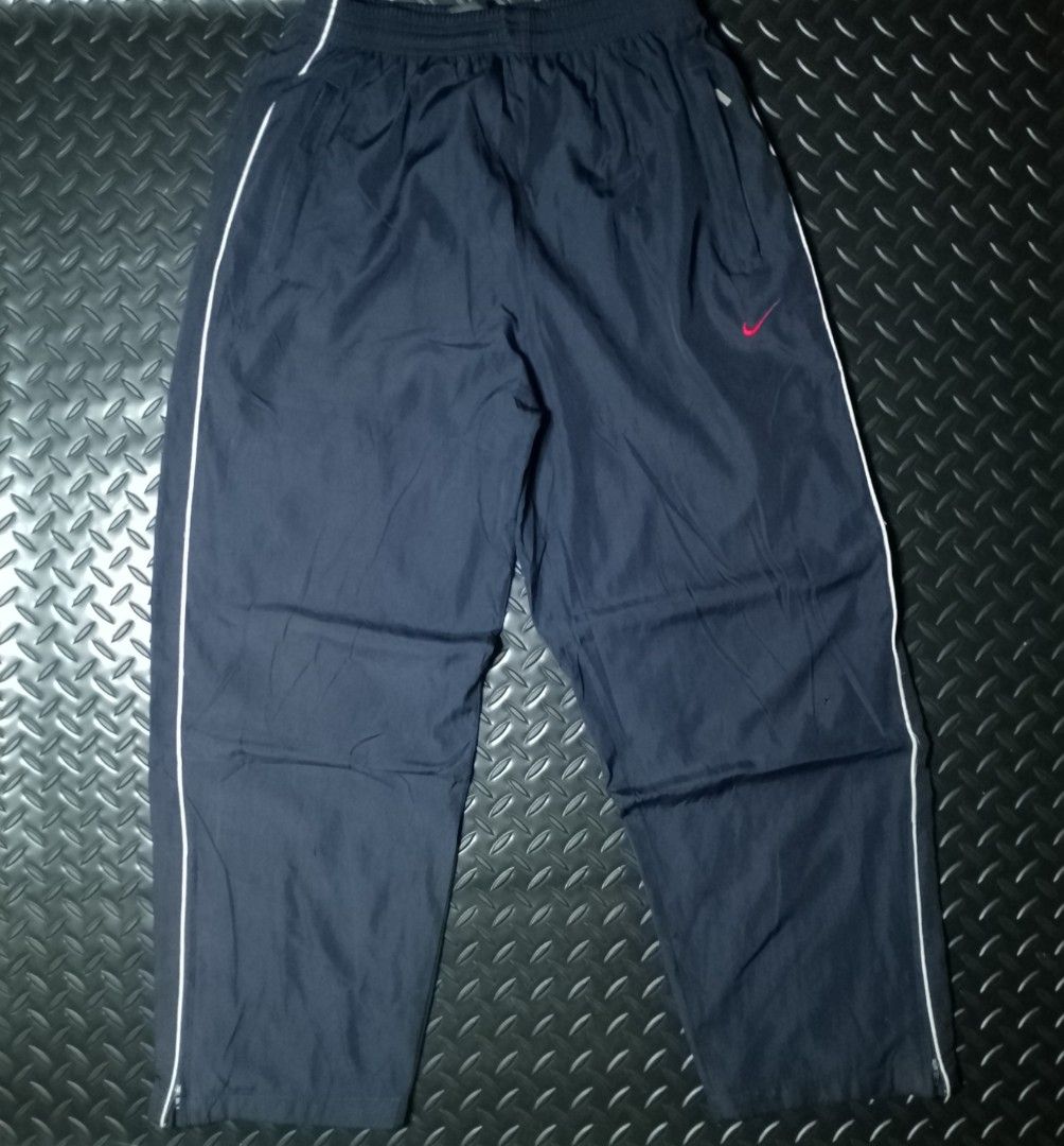Vintage Y2k Nike Track Pants (Category: Activewear) located in Baguio. Submitted by bado.feels (Listing ID 1470478297, Image 1). Description: Issue: Pinhole Size 26-38 Length 37 Thigh 12 Leg Opening 8 550+sf.