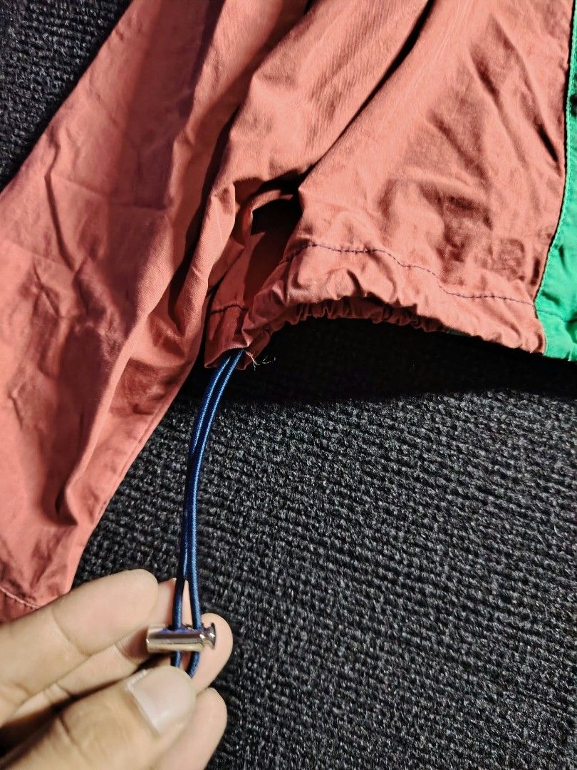 Vivienne Westwood Colorblock Button Up Cropped Jacket (Category: Coats, Jackets and Outerwear) located in Baguio. Submitted by tabuzomaria1422 (Listing ID 1470486246, Image 3). Description: - Brand: Vivienne Westwood - Design: Multi-color block with navy blue base and green, red, and white vertical stripes - Details: Signature white embroidered orb logo on the chest - Fit & Features: Collared neckline, long sleeves, button-up front, and adjustabl