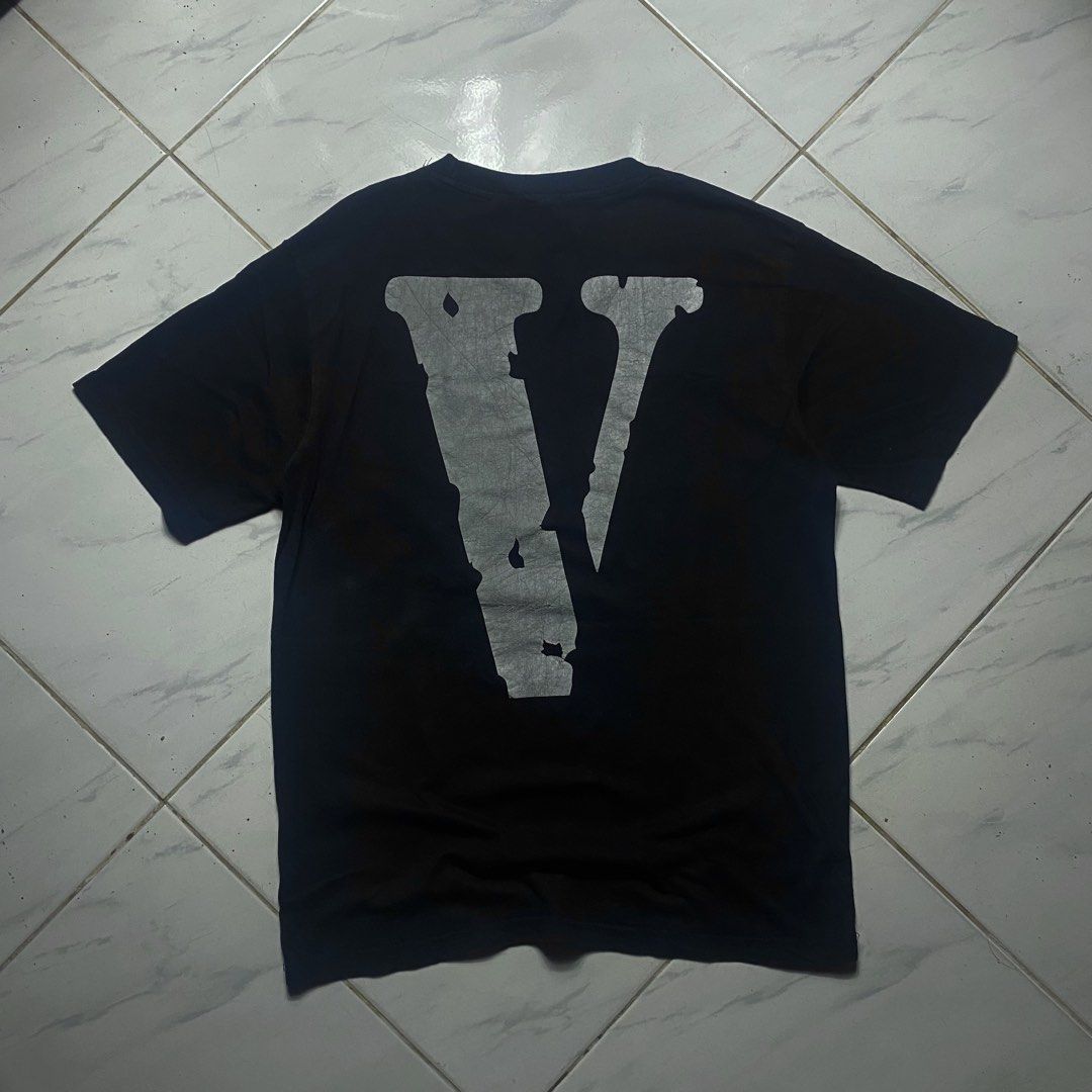 Vlone Black Graphic T-Shirt (Category: Tshirts & Polo Shirts ) located in Camiling. Submitted by camthrift_2024 (Listing ID 1470368671, Image 3). Description: VLONE REFLECTORIZED M-semi L 20x28 COLOR RATE: 9/10 ISSUE:crackprint ₱250 PEDE VC SA JNT SHIP NOW OPEN FOR TERMS UNLI VOUCH GCASH JNT CAMILING, TARLAC📌 - Authentic Black Vlone T-Shirt (Size Large) - 100% premium cotton build made in USA - Bold vertical Vlone text graphic on the front chest