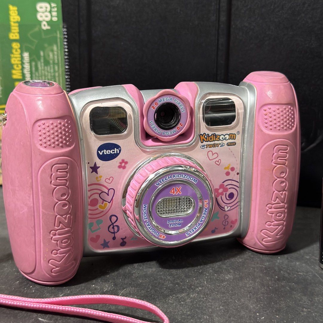 VTech Kidizoom Twist Plus Pink Digital Camera (Category: Cameras) located in Cuyapo. Submitted by blacksheepshop (Listing ID 1470518372, Image 3). Description: - Model: VTech Kidizoom Twist Plus (Pink/Silver) - 2.0 Mega Pixels with 4X digital zoom - Rotating lens for easy selfies - Built-in LCD screen and fun control buttons - Includes attached pink wrist strap - Captures both photos and videos - Powered by standard batteries - Great, durable toy