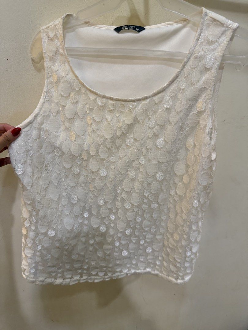 Wanko White Lace Tank Top Size 38 (Category: Sleeveless) located in Las Pinas. Submitted by privari (Listing ID 1470389486, Image 2). Description: - Brand: Wanko - Size: 38 - Color: White - Design: Scoop neckline with textured polka dot lace overlay (front and back) - Lining: Fully lined interior - Style: Lightweight, sleeveless, slip-on tank top - Condition: Excellent.