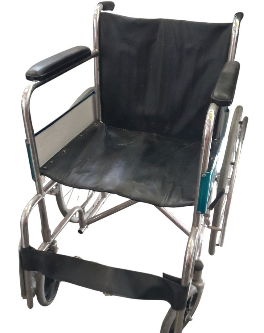 Wheelchair with Black Upholstery (Category: Wheelchairs) located in Mandaluyong City. Submitted by twixie94147 (Listing ID 1470369007, Image 1). Description: - Frame: Durable chrome steel - Material: Easy-to-clean black synthetic leather seat and backrest - Comfort: Padded armrests and supportive calf strap on footrests - Mobility: Large rear spoked wheels and smooth front casters - Convenience: Space-saving foldable design for easy transport and