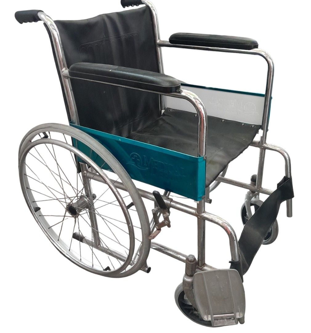 Wheelchair with Black Upholstery (Category: Wheelchairs) located in Mandaluyong City. Submitted by twixie94147 (Listing ID 1470369007, Image 2). Description: - Frame: Durable chrome steel - Material: Easy-to-clean black synthetic leather seat and backrest - Comfort: Padded armrests and supportive calf strap on footrests - Mobility: Large rear spoked wheels and smooth front casters - Convenience: Space-saving foldable design for easy transport and