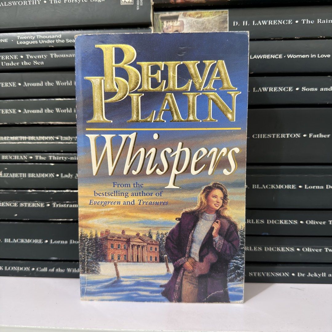 Whispers by Belva Plain Paperback Novel (Category: Storybooks) located in Lingayen. Submitted by readwjane (Listing ID 1470480027, Image 1). Description: - Title: Whispers by Belva Plain - Format: Standard paperback - Genre: Fiction story - Cover: Scenic snowy landscape featuring a large house - Condition: Readable pages with light wear along the edges from handling and shelf storage.