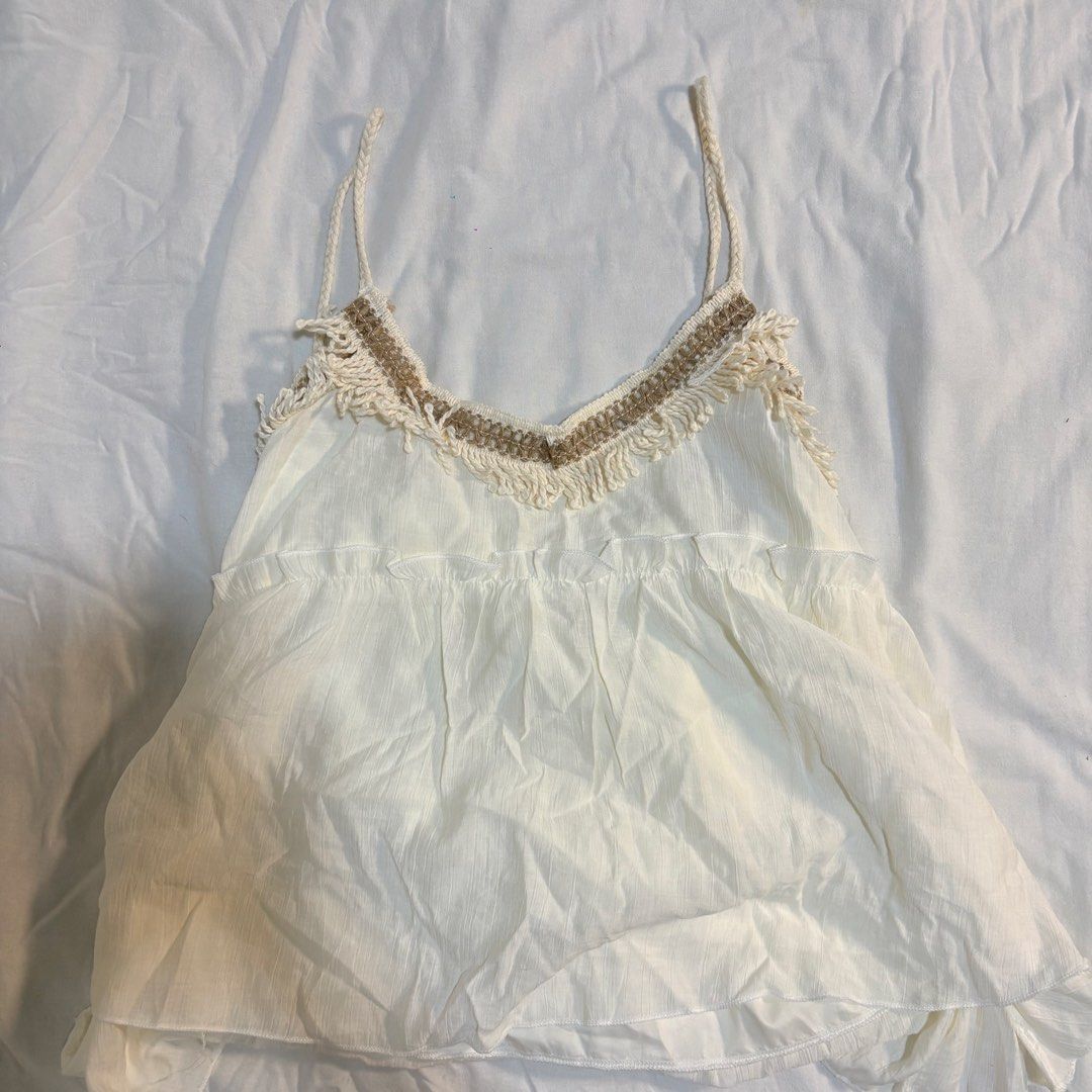 White Boho Fringe Cami Top With Braided Straps (Category: Sleeveless) located in Manila. Submitted by yiiio3o (Listing ID 1470508494, Image 1). Description: Size: L (no exact measurements since it was bought in china) RFS: too small 📍Binondo.