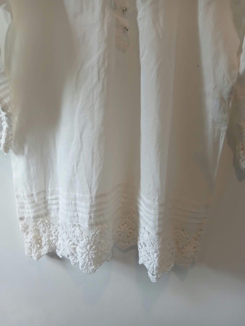 White Boho Lace Blouse (Category: Blouses) located in Antipolo. Submitted by wisecat.4a7eea (Listing ID 1470398848, Image 3). Description: - Color: White - Material: Lightweight and breathable fabric - Details: Delicate lace on hem and cuffs, tie neckline with small buttons - Sleeves: 3/4 sleeves - Size: Fits Small to Medium - Condition: Clean and ready to wear - Styling: Perfect to pair with denim shorts or skirts.