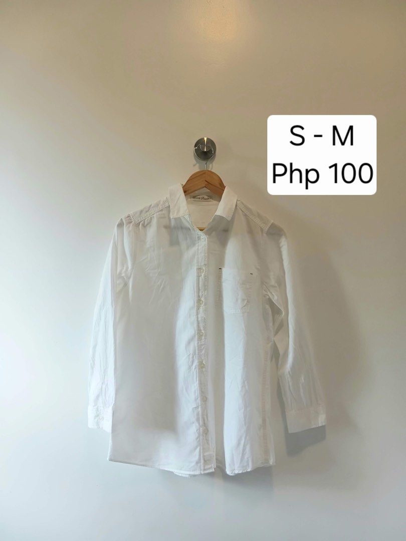 White button down shirt S-M (Category: Shirts) located in Antipolo. Submitted by wisecat.4a7eea (Listing ID 1470398687, Image 1). Description: - Color: Classic White - Fit: Fits small to medium frames - Design: Classic collar, front button closure, and single left chest pocket - Sleeves: Long sleeves with button cuffs - Fabric: Lightweight and breathable material - Versatility: Perfect for both casual and office outfits.
