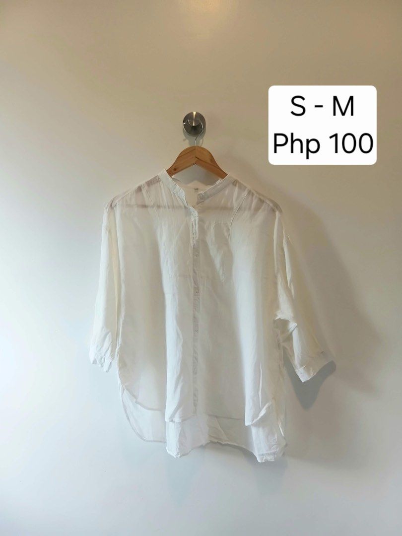 White Button Up Blouse Mandarin Collar Size S-M (Category: Blouses) located in Antipolo. Submitted by wisecat.4a7eea (Listing ID 1470399248, Image 1). Description: - Color: Classic White - Design: Mandarin collar, half sleeves, back yoke with slight gathering - Fit: Relaxed fit, high-low curved hemline, fits small to medium frames - Material: Light fabric with a soft drape - Styling: Versatile basic piece, easy to match with jeans or skirts for c