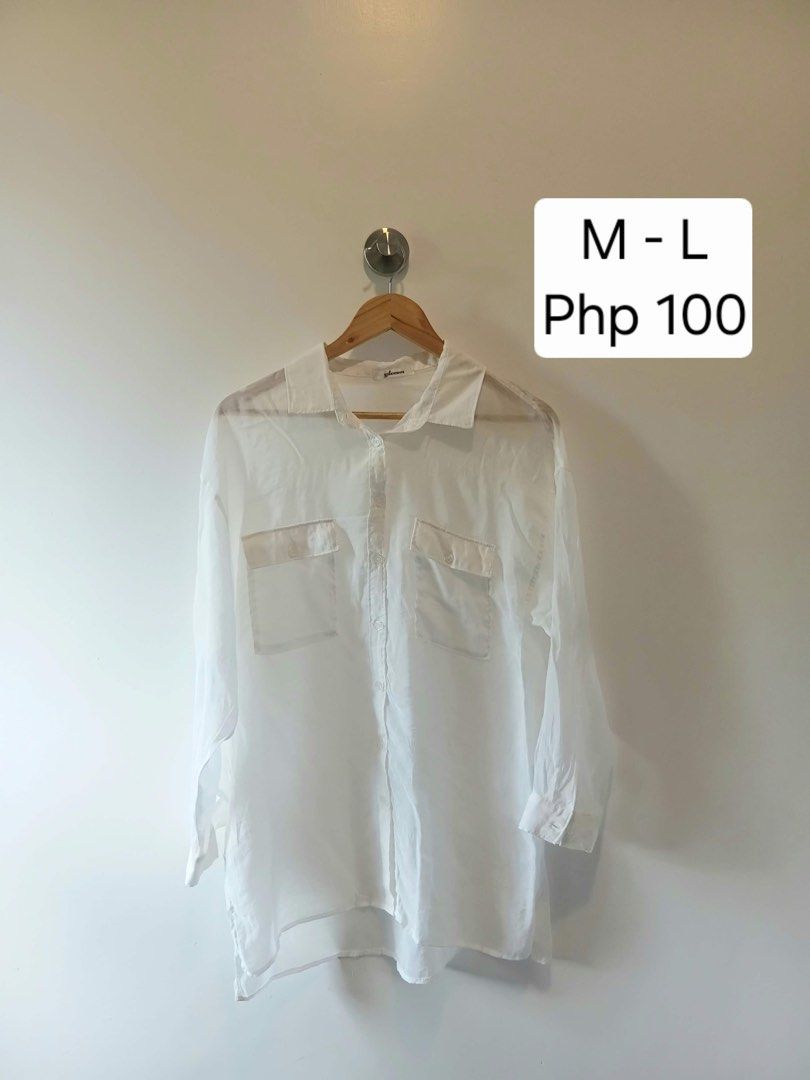 White Button-Up Shirt (Category: Shirts) located in Antipolo. Submitted by wisecat.4a7eea (Listing ID 1470398527, Image 1). Description: - Color: White - Fit: Oversized/Relaxed - Sleeves: Long sleeves - Details: Collared neckline, dual front chest pockets, plain back with box pleat - Fabric: Lightweight and slightly sheer - Style: Great casual piece for layering.