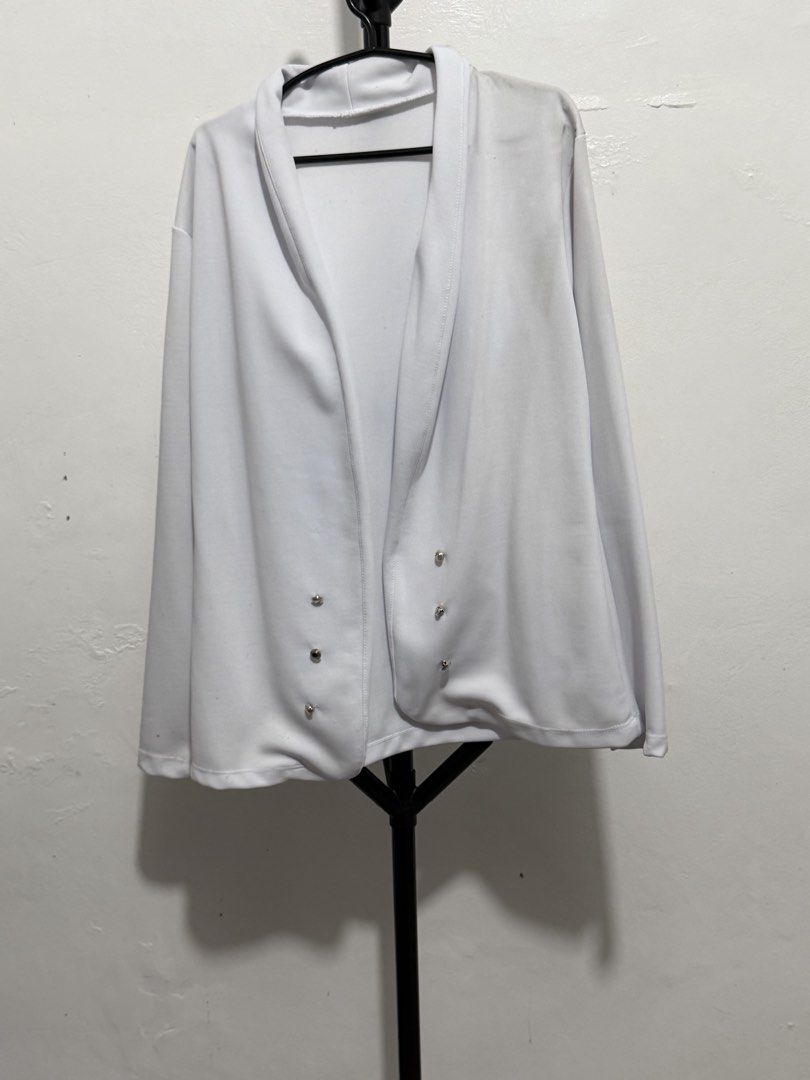 White cardigan open front jacket with metallic buttons (Category: Coats, Jackets and Outerwear) located in Mandaluyong City. Submitted by jdflores17 (Listing ID 1470454998, Image 2). Description: - Color: White - Style: Open-front cardigan jacket with a chic shawl collar and long sleeves - Design Details: Features stylish decorative silver metallic buttons on the lower front panels - Fabric: Lightweight drape style for effortless layering - Versa