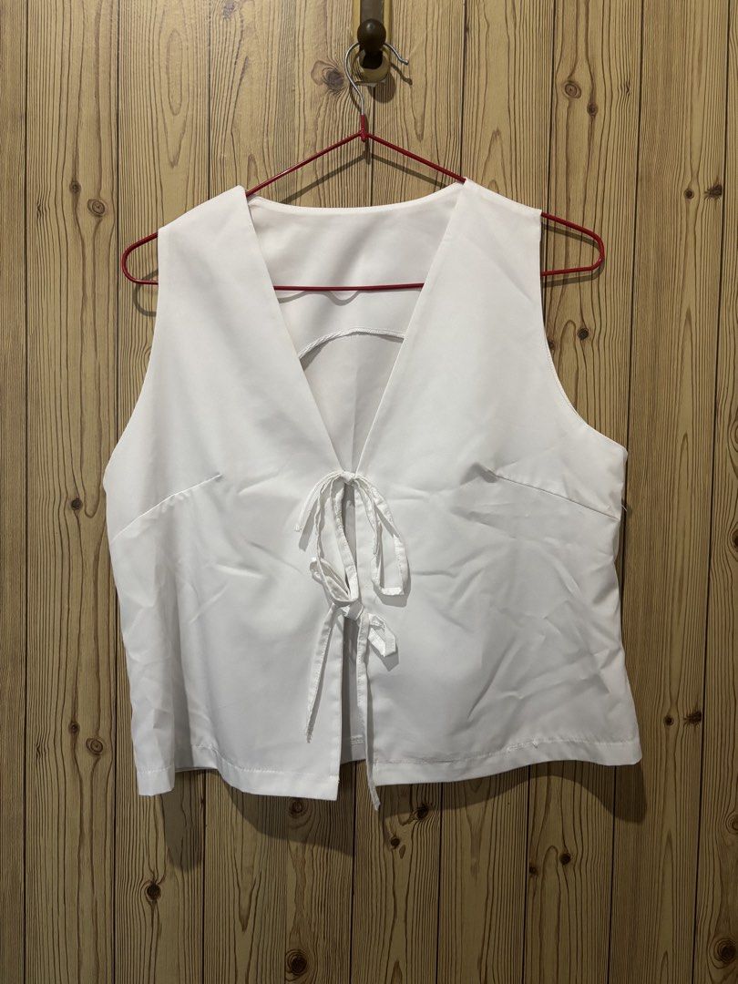 White crop tops bundle (Category: Sleeveless) located in Manila. Submitted by yas__ (Listing ID 1470434576, Image 2). Description: - 50 pesos each - Set of 5 versatile white cropped tops - Includes: ribbed short-sleeve cardigan with buttons, sleeveless vest with string ties, fuzzy long-sleeve crop sweater, and 2 eyelet lace camisoles with strap details - Cropped length, perfect for summer or layering.