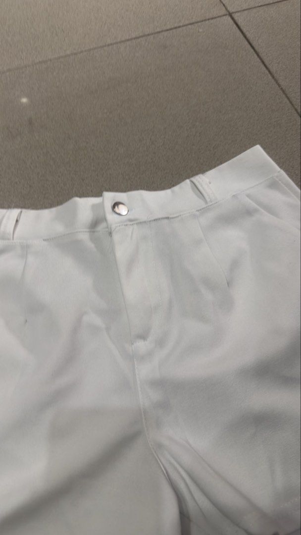 White high-waist tailored shorts with front button (Category: Shorts) located in Quezon City. Submitted by outyougoph (Listing ID 1470362406, Image 2). Description: - Color: Crisp white - Style: Tailored with subtle front pleats and a clean silhouette - Features: Front button closure, belt loops, and deep functional side pockets - Fabric: Smooth, lightweight, and comfortable for warm weather - Condition: Excellent / Brand new (ready to wear).