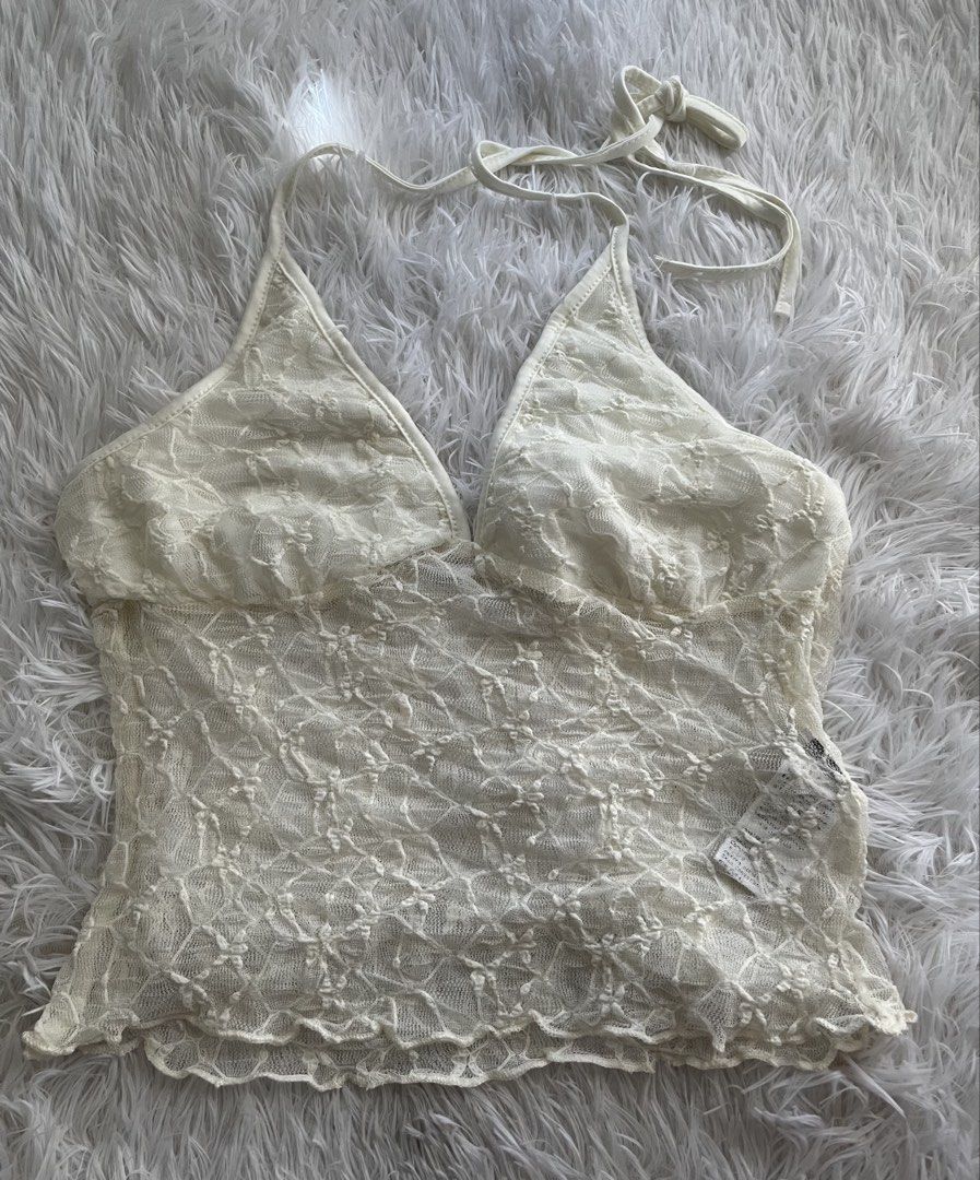 white lace halter top open back (Category: Sleeveless) located in Mandaluyong City. Submitted by xo.miel (Listing ID 1470412938, Image 1). Description: Style: Sheer lace halter top with lettuce hem Fit: Adjustable ties behind the neck Size: medium - semi large.