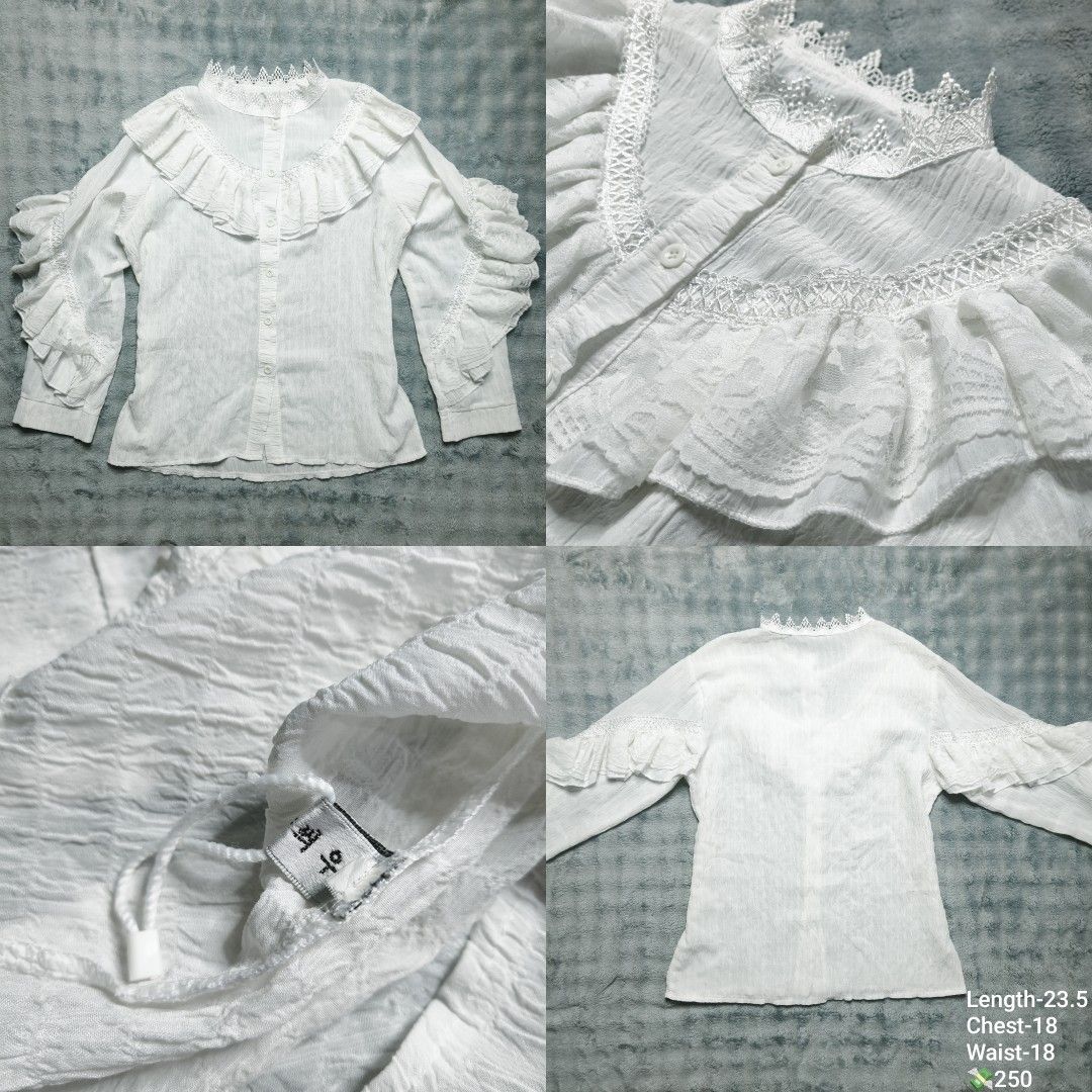 White Lace Ruffle Long Sleeve Blouse (Category: Longsleeves) located in Floridablanca. Submitted by vintager12 (Listing ID 1470403438, Image 1). Description: - Color: Classic White - Style: Button-down blouse with intricate lace trim and layered ruffles on collar and sleeves - Fabric: Lightweight textured crinkle fabric - Details: Front button closure, authentic Korean text tag inside - Measurements: Length 23.5", Chest 18", Waist 18" - Condition