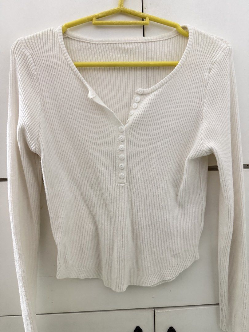 White long sleeve ribbed top with buttons (Category: Longsleeves) located in Manila. Submitted by mnlclaudia (Listing ID 1470510111, Image 1). Description: - Color: Classic White - Style: Slim fit long sleeve top with a curved waist-length hem - Material: Soft, highly stretchable ribbed knit for ultimate comfort - Details: Scoop neckline with a cute row of functional front buttons - Condition: Brand new / Excellent quality - Perfect for: Daily ca
