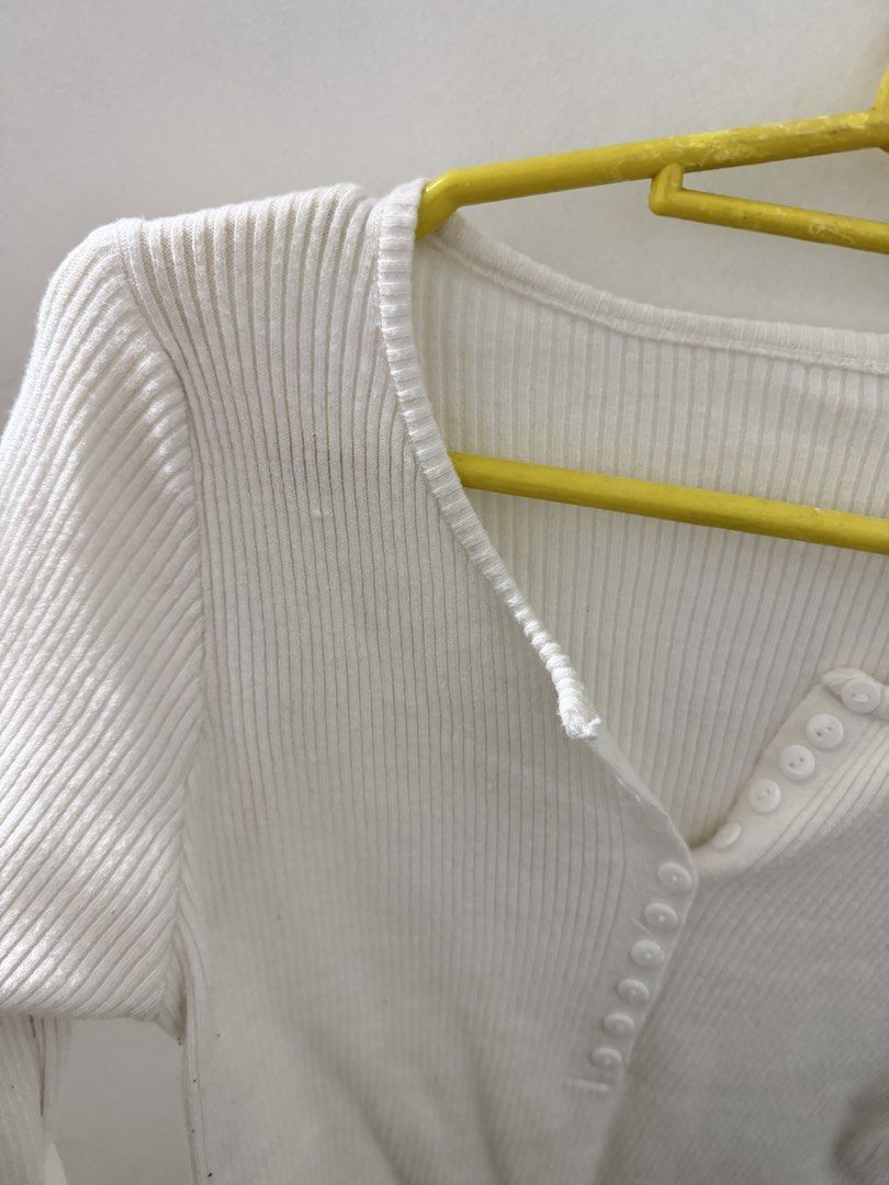 White long sleeve ribbed top with buttons (Category: Longsleeves) located in Manila. Submitted by mnlclaudia (Listing ID 1470510111, Image 2). Description: - Color: Classic White - Style: Slim fit long sleeve top with a curved waist-length hem - Material: Soft, highly stretchable ribbed knit for ultimate comfort - Details: Scoop neckline with a cute row of functional front buttons - Condition: Brand new / Excellent quality - Perfect for: Daily ca
