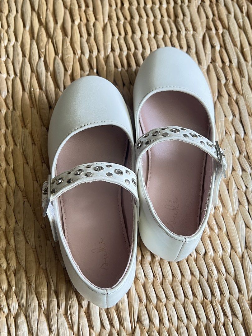 White Mary Jane Flat Shoes with Studded Straps (Category: Babies & Kids Fashion) located in San Fernando. Submitted by wearvfs (Listing ID 1470516991, Image 3). Description: - Color: White with soft pink inner lining - Design: Studded strap detail with silver side buckle closure - Size: EU 28 (approx. 18.5 cm outsole length) - Condition: Excellent, barely worn, clean soles .