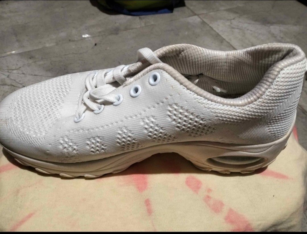 White Mesh Sneakers Size 38 (Category: Sneakers) located in Quezon City. Submitted by juliaela (Listing ID 1470393970, Image 2). Description: - Style: Casual low-top athletic sneakers - Color: Classic White - Size: 38 (printed on inner tongue tag) - Material: Breathable knit mesh upper with chunky sole - Comfort: Built-in air cushion unit in the heel - Closure: Lace-up with matching white laces - Once lang sinuot sa cheer dance.