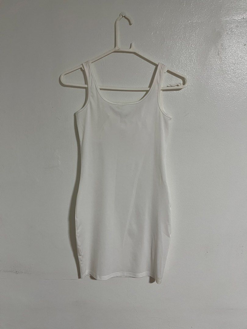 White Ruched Bust Bodycon Mini Dress with Bow (Category: Dresses) located in Cabuyao City. Submitted by rdtrmt (Listing ID 1470440902, Image 3). Description: - Color: White - Style: Sleeveless bodycon mini dress - Neckline: Scooped with ruched bust detailing and center bow accent - Straps: Standard tank straps - Back: Plain and solid white - Fit: Form-fitting silhouette - Condition: still in good condition .