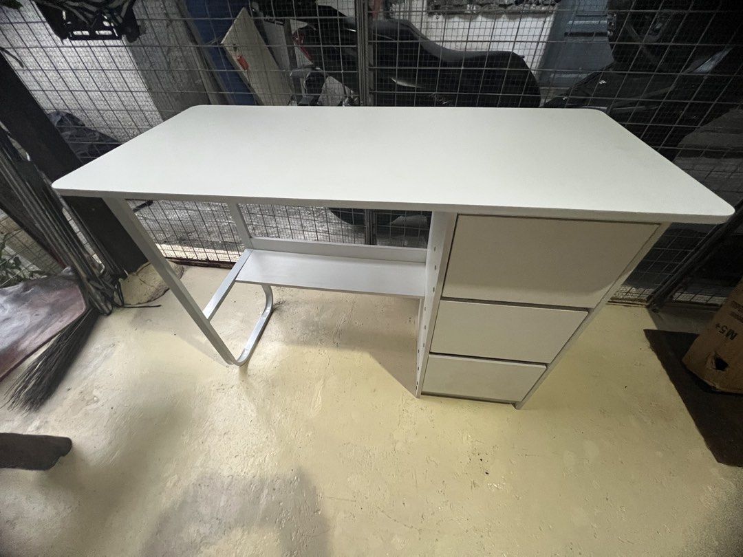 White Study Desk with 3 Drawers and Shelf (Category: Office Furniture & Fixtures) located in Caloocan City. Submitted by jemelee (Listing ID 1470445903, Image 2). Description: Clean white office desk featuring 3 drawers, an open shelf, and a sturdy metal leg. Dimensions: 100cm x 45cm x 74.5cm. Perfect for home offices or bedrooms..