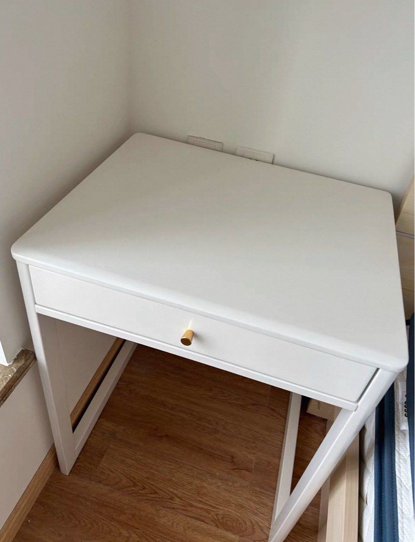 White Study Desk with Single Drawer and Gold Knob (Category: Tables & Sets) located in Marikina City. Submitted by lovegoeson (Listing ID 1470398317, Image 2). Description: - Color: Clean white finish with elegant gold-toned knob handle - Storage: Convenient pull-out drawer for stationery and essentials - Design: Sturdy angled white metal frame legs - Size: Compact footprint, ideal for small bedrooms, dorms, and tight study spaces - Condition: Cl