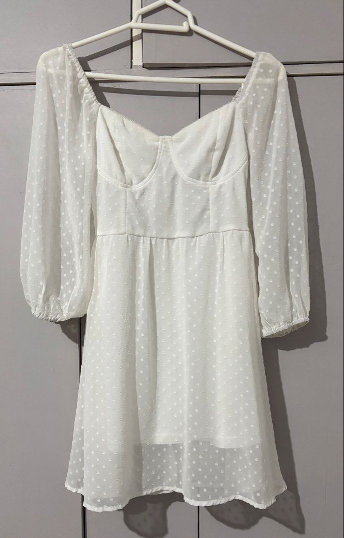 White Swiss Dot Long Sleeve Mini Dress (Category: Dresses) located in Batangas. Submitted by rm0401 (Listing ID 1470350093, Image 1). Description: - Color: White with all-over Swiss dot pattern - Fit & Style: Structured sweetheart bustier bodice and flowy A-line skirt - Sleeves: Long sheer sleeves with comfortable elastic cuffs - Details: Fully lined skirt, easy back zipper closure - Occasion: Ideal for dates, brunch, or casual day outs size: s-m