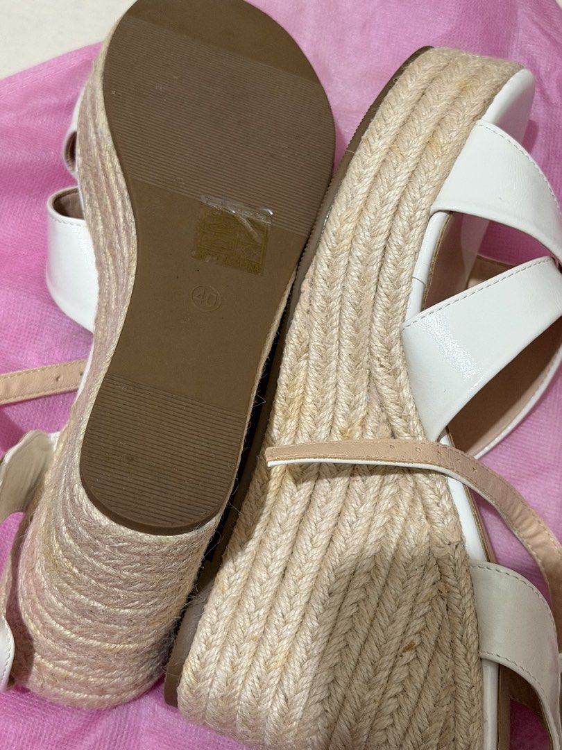White Wedge Espadrille Sandals Platform Heels Size 40 (Category: Wedges) located in Manila. Submitted by declutterwtmaan (Listing ID 1470486180, Image 3). Description: - Style: Strappy wedge sandals with jute-wrapped heels and platform for extra height - Closure: Adjustable ankle buckle - Size: 40 (marked on sole) - Color: Neutral white (easy to match with any summer outfit) - Comfort: Cushioned and comfortable sole for all-day wear - No brand - 