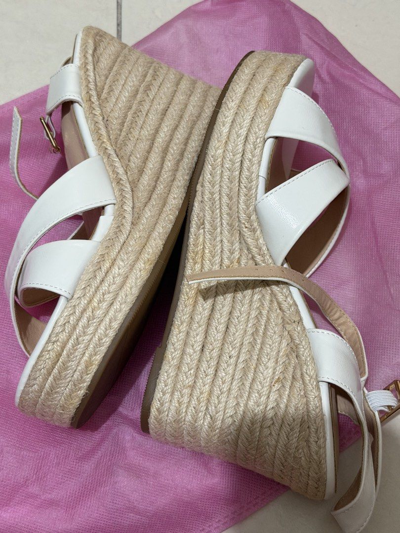 White Wedge Espadrille Sandals Platform Heels Size 40 (Category: Wedges) located in Manila. Submitted by declutterwtmaan (Listing ID 1470486180, Image 2). Description: - Style: Strappy wedge sandals with jute-wrapped heels and platform for extra height - Closure: Adjustable ankle buckle - Size: 40 (marked on sole) - Color: Neutral white (easy to match with any summer outfit) - Comfort: Cushioned and comfortable sole for all-day wear - No brand - 